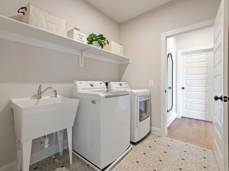 Laundry Room - Full-size washer and dryer, a deep utility sink, and plenty of storage for towels and beach gear.