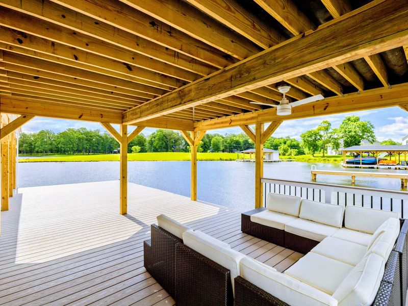 Backyard - Covered slips with a pontoon tied up, keeping the fleet out of the sun and ready to launch.