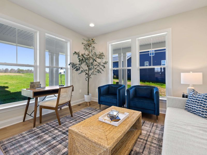 Office - A quiet workspace with a desk, sitting chairs, and big windows that pull in lake light all day.
