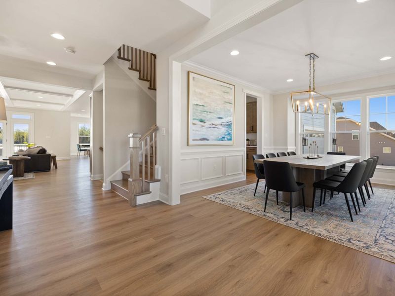 Formal Dining Room - A more elevated dining space off the main entry, ready for the full-group dinner with a statement chandelier overhead.