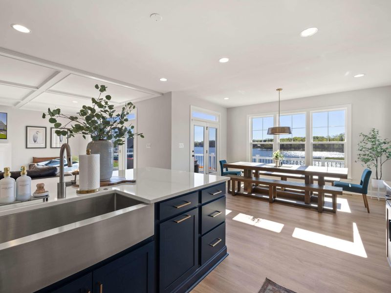 Kitchen - Deep farmhouse-style sink at the island, an easy workstation with the lake view in the background.
