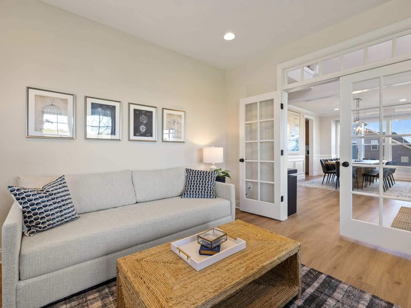 Office - Wide view of the office with french doors opening into the main living space.