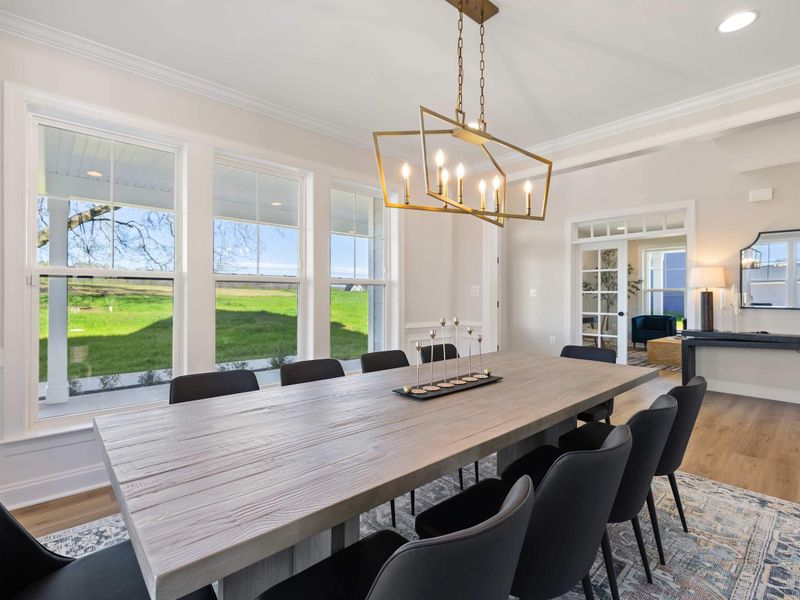 Formal Dining Room - Another angle of the formal dining room, with a dozen seats ready under a brass chandelier.