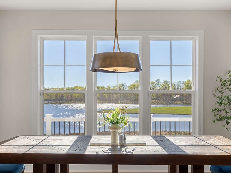 Great Room Dining Area - Bench seating on one side keeps this casual dining table flexible for kids and adults together.