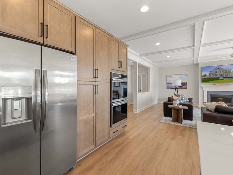 Kitchen - Full-size stainless fridge tucked between cabinets, stocked and ready for a week of lake mornings.