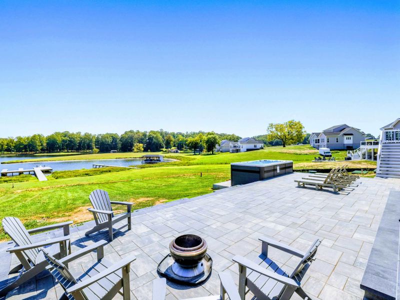 Patio - A wide back patio between the house and the water, built for slow afternoons and big group dinners.