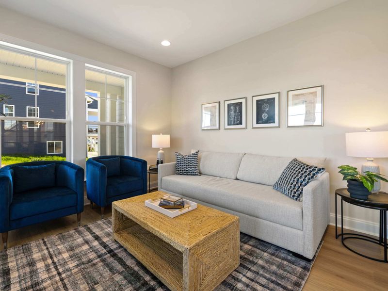 Office - Another view of the office with a sofa, accent chairs, and a soft rug for a calm spot to work or unwind.