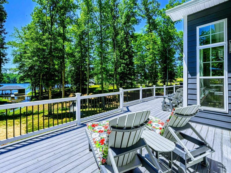 Enjoy the spacious deck with plenty of seating, perfect for outdoor relaxation and dining.