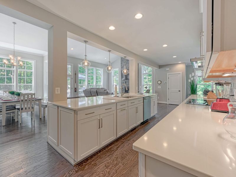 Spacious open-concept kitchen and dining area with large windows for natural light.