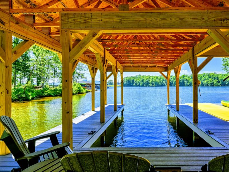 Covered dock with comfortable seating and stunning lake views, perfect for relaxation and water activities