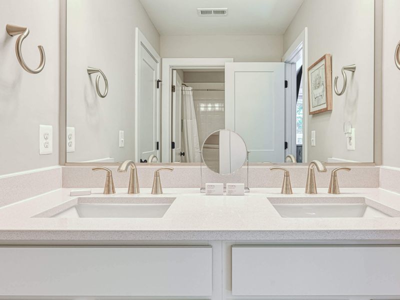 Modern bathroom with a double vanity and elegant fixtures
