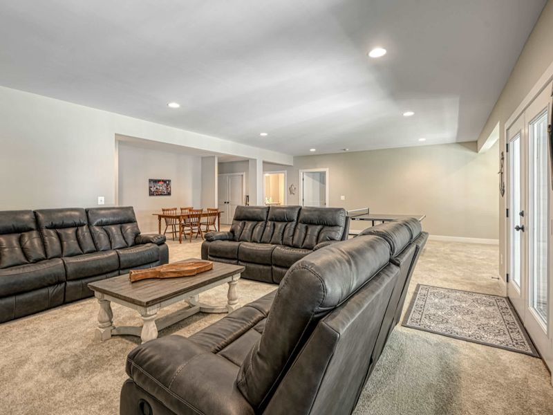Spacious and comfortable living area with ample seating and scenic outdoor views.