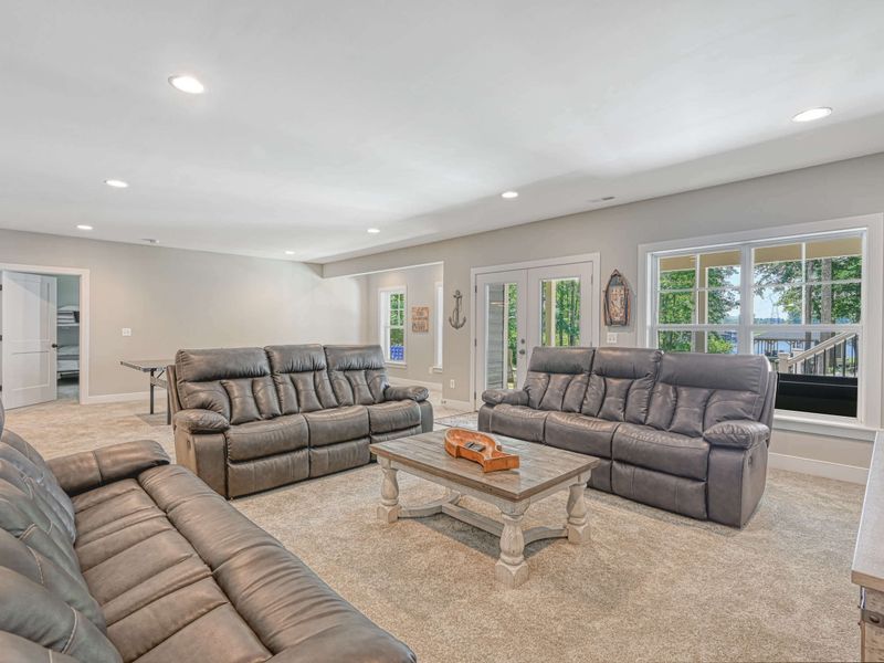 Spacious and comfortable living area with ample seating and scenic outdoor views.