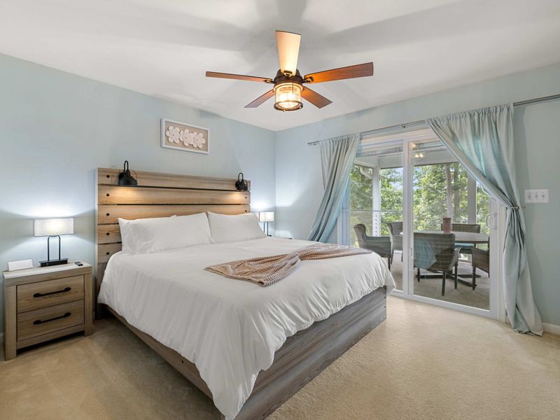 A cozy and stylish bedroom with a king-size bed, warm lighting, and modern decor, offering a peaceful retreat for guests.