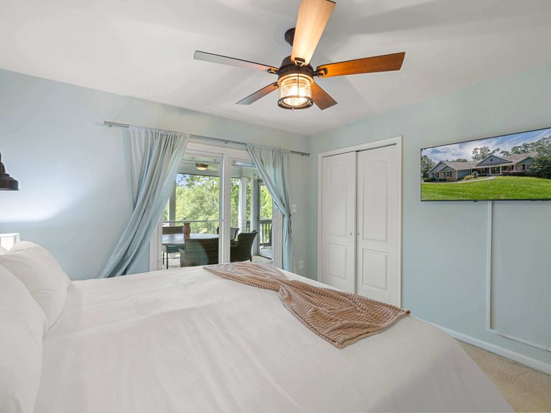 A cozy and stylish bedroom with a king-size bed, warm lighting, and modern decor, offering a peaceful retreat for guests.