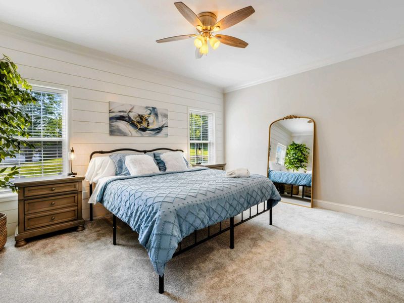 Primary Suite - Bright and serene bedroom with a king-sized bed and stylish decor, perfect for a restful stay