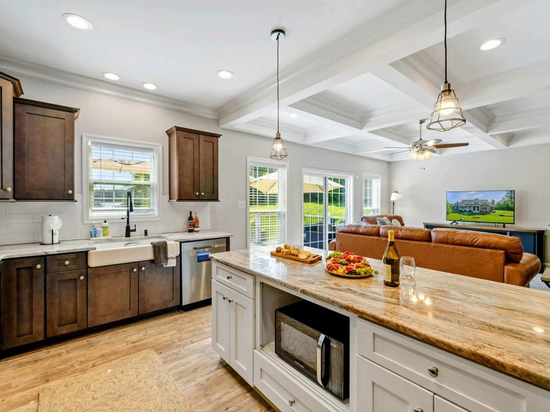 Open and inviting kitchen that flows seamlessly into the living room, perfect for entertaining and family gatherings