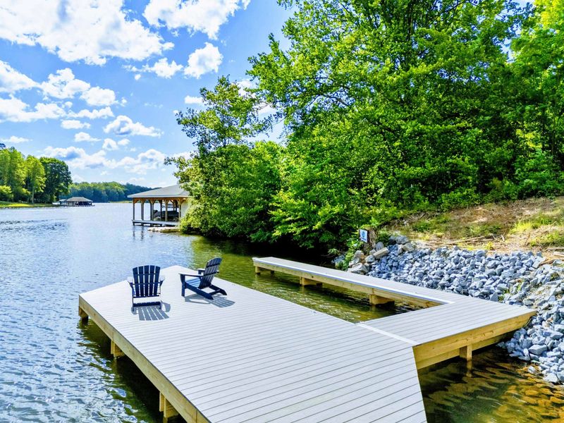 Sun, Shade & Lake Days Ahead. From morning light to golden hour, this dock is your front-row seat to the rhythm of the lake.