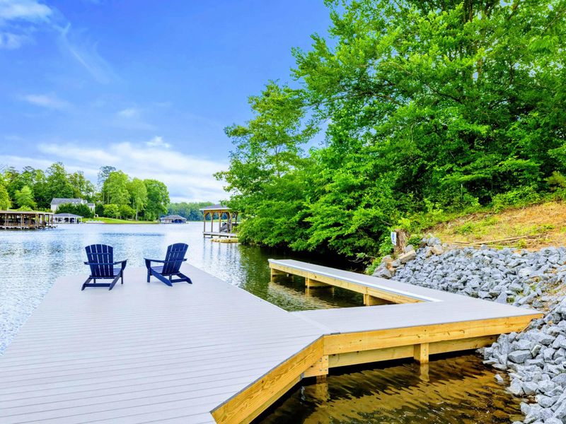 A Front-Row Seat to Lake Life. Watch boats drift by, wave to neighbors, and enjoy the hum of summer days on the water.