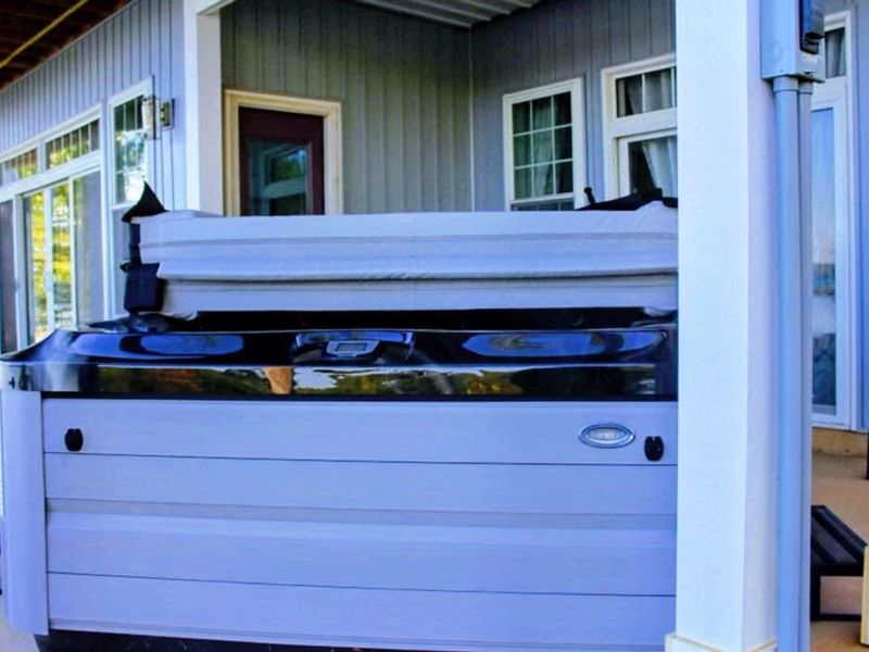 Relax in our brand new outdoor hot tub on the back patio, perfectly positioned for enjoying stunning water views.
