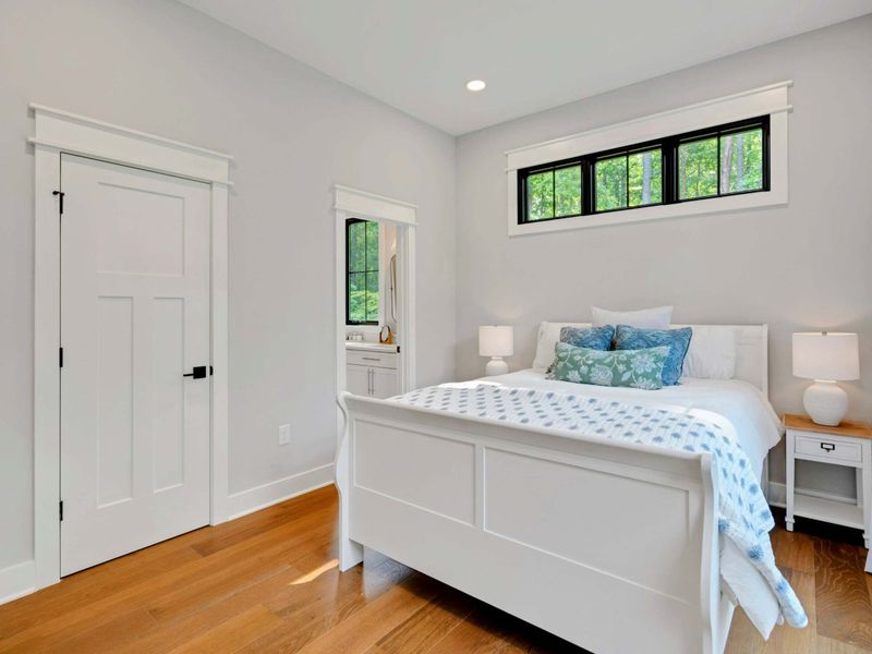 Main level queen guest room with jack and jill full bath.