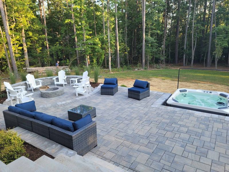 Relax on our newly built patio, complete with a warm fire pit, a large 7-person hot tub, and a dedicated grilling space for the perfect outdoor retreat.