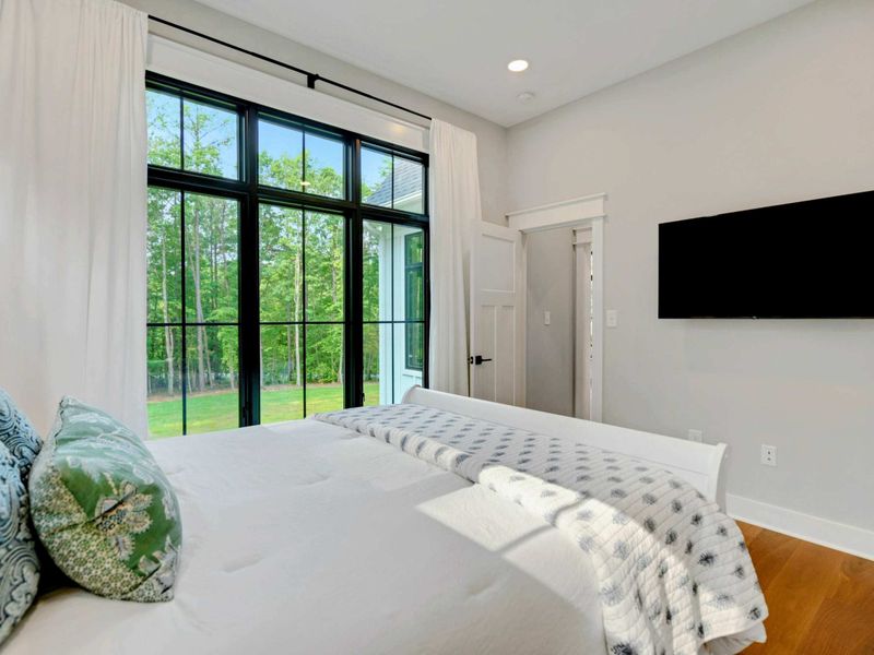 Main level queen room. All bedrooms including bunk room have flat screen tv's.