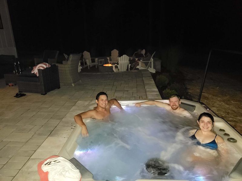 Unwind in our spacious 7-person hot tub under the stars, while enjoying the warmth of the fire pit and the perfect setting for a relaxing evening with friends and family.