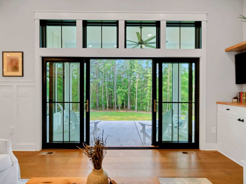 Great Room surrounded by windows and 12 ft ceilings.