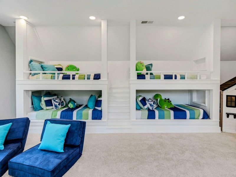 Upper level 4 bunk room suite with full bath and shower.