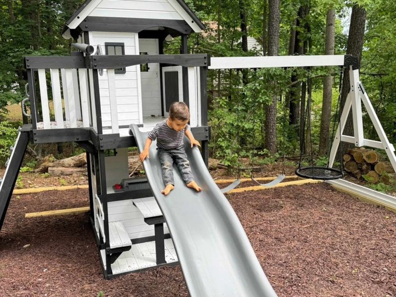 Watch the kids slide, swing, and explore on our delightful playset, providing endless fun and adventure in a safe and natural setting.