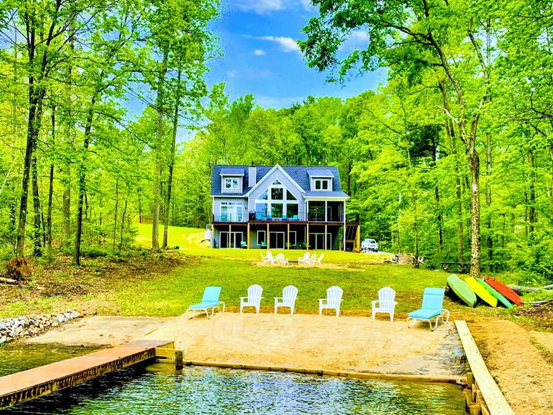 Lakefront - Your own slice of the cove: a private sandy beach, dock, and Adirondack chairs on the lawn waiting for the day to begin.