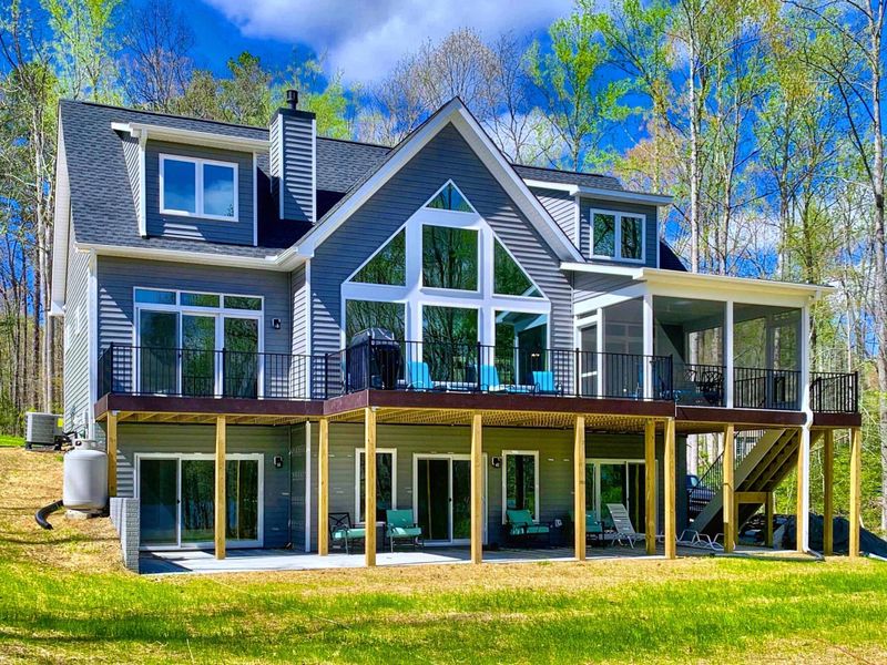 Deck - Tiered outdoor living wraps the lakeside of the home, room to spread across two levels with the cove always in view.