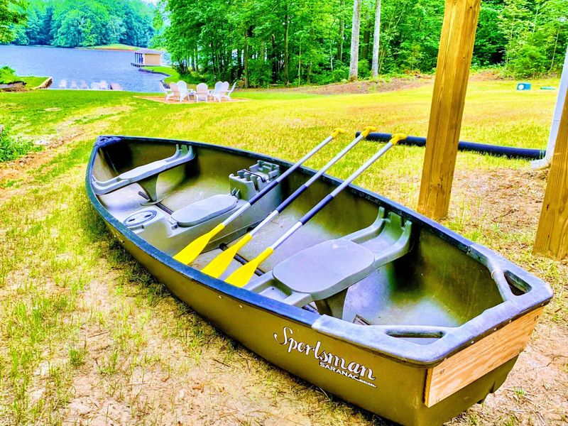 Canoe - Room for three and a quiet paddle into the no-wake cove, a slow morning on glassy water before the lake wakes up.