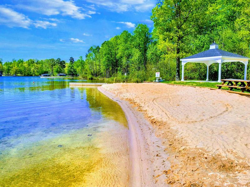 Community Beach - The deep, sandy neighborhood beach curves into calm water, larger and better kept than most, a quarter-mile from the door.