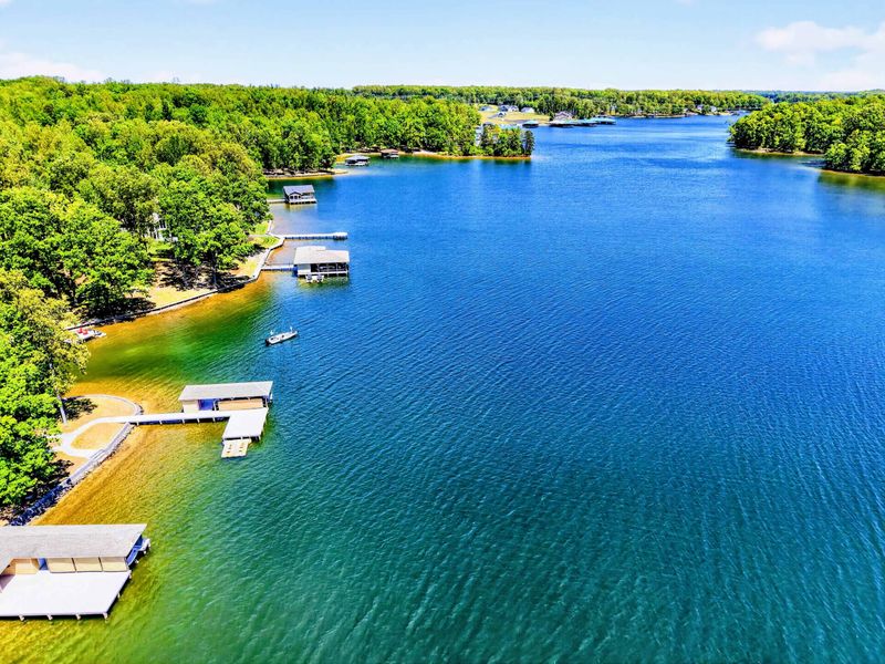 Aerial - Open water in every direction, with coves and boathouses dotting a shoreline made for slow boat rides.