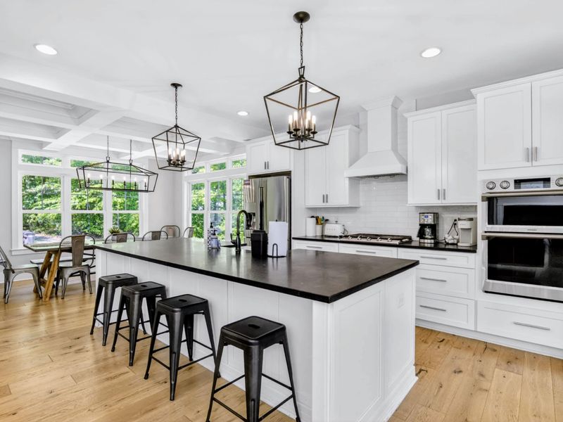Kitchen - Oversize island, double ovens, and a sunny breakfast nook, every meal has a spot worth sitting at.