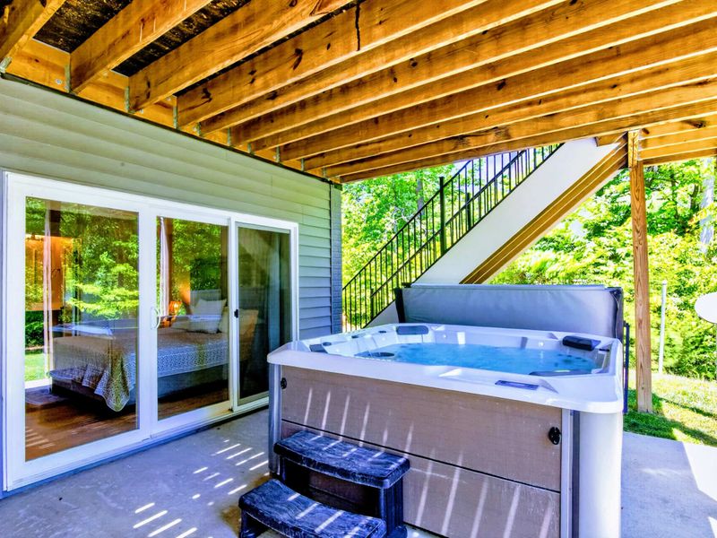 Hot Tub Patio - Slide open the doors from the bedroom, step into the hot tub, and let the lake air do the rest.