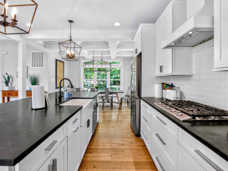 Kitchen - Gas cooktop, deep farmhouse sink, and a clear sightline to the breakfast nook, built for the cook who wants company.