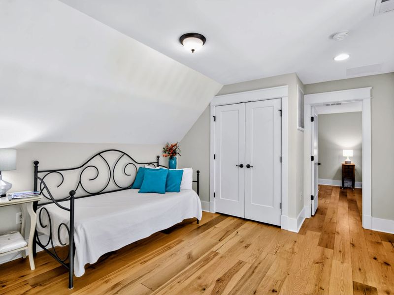 Loft - Wrought-iron daybed and pops of turquoise give this flexible room a kid-friendly, cozy feel.