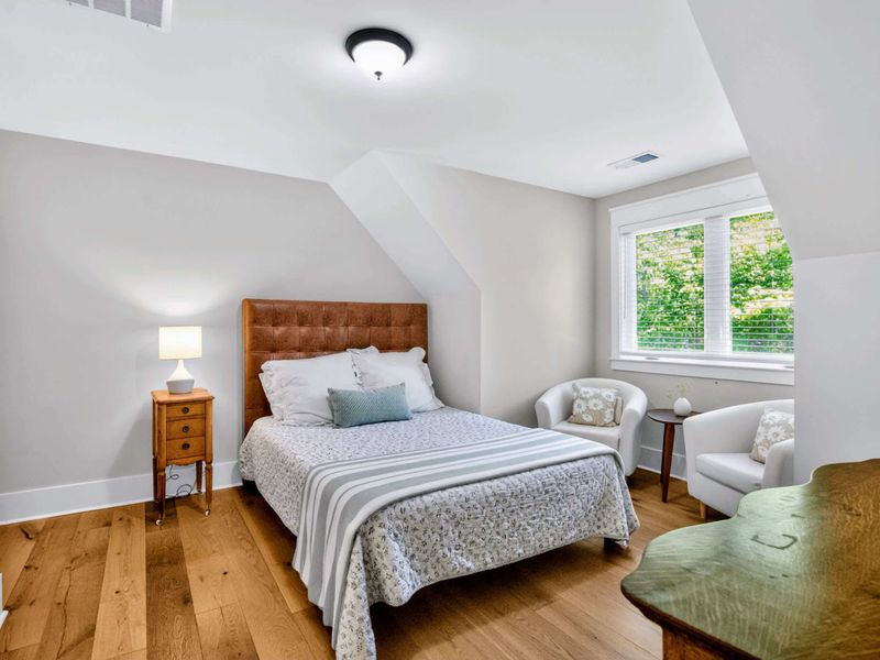 Suite 5 - Leather tufted headboard and a pair of armchairs by the window make this a calm corner to land at the end of the day.