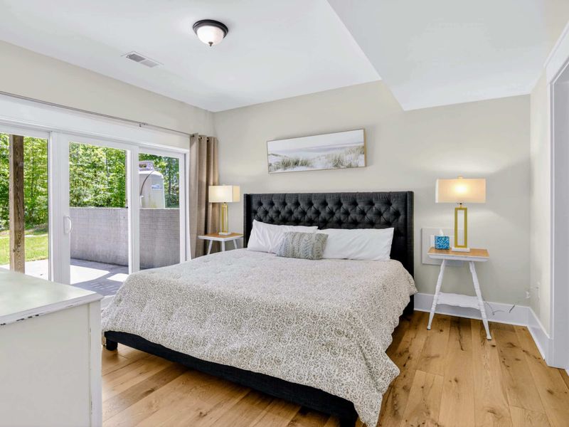 Suite 2 - King bed steps from your own hot tub through the sliding door, an early-morning soak with nobody around.