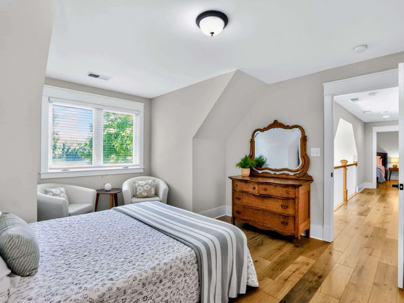 Suite 5 - Antique dresser with carved mirror keeps the upstairs feeling like a country inn, warm and lived in.