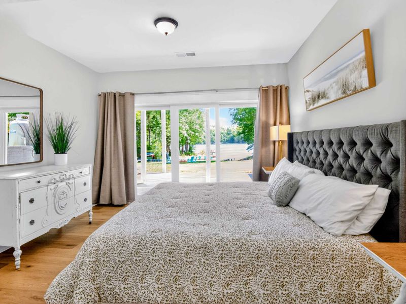 Suite 2 - Wake up to the lake through floor-to-ceiling glass, the Adirondacks waiting just outside.