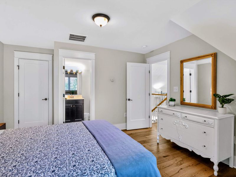 Suite 4 - Gold-framed mirror, antique dresser, and an en-suite bath right off the room keep things simple.