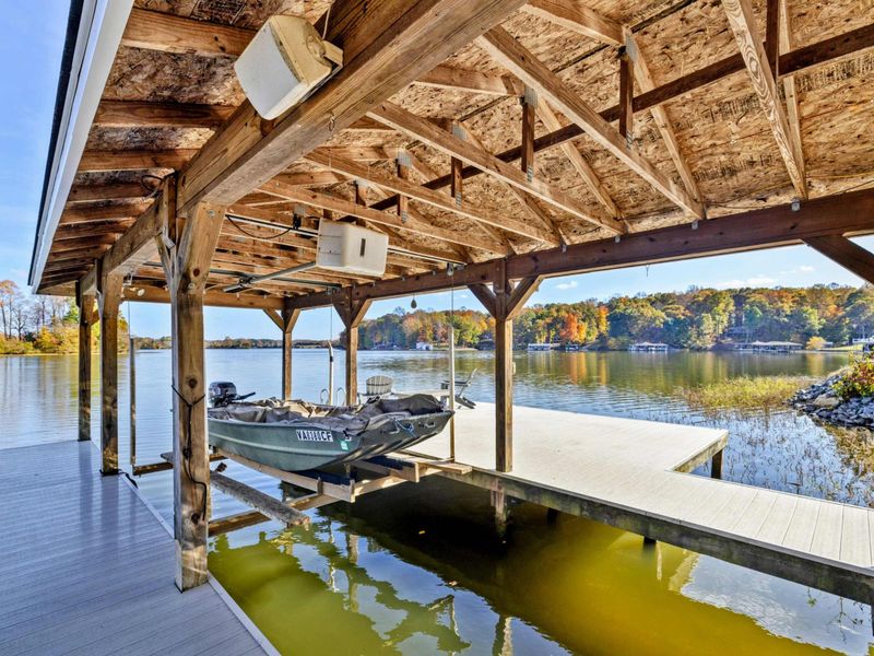 Covered boat dock with stunning lake views, ideal for boating enthusiasts and lakefront relaxation