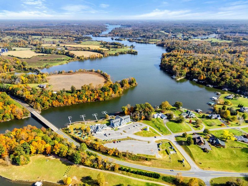 Aerial - Wide panoramic drone shot over Lake Anna showing the bridge, dam area, and stunning autumn colors across the landscape.