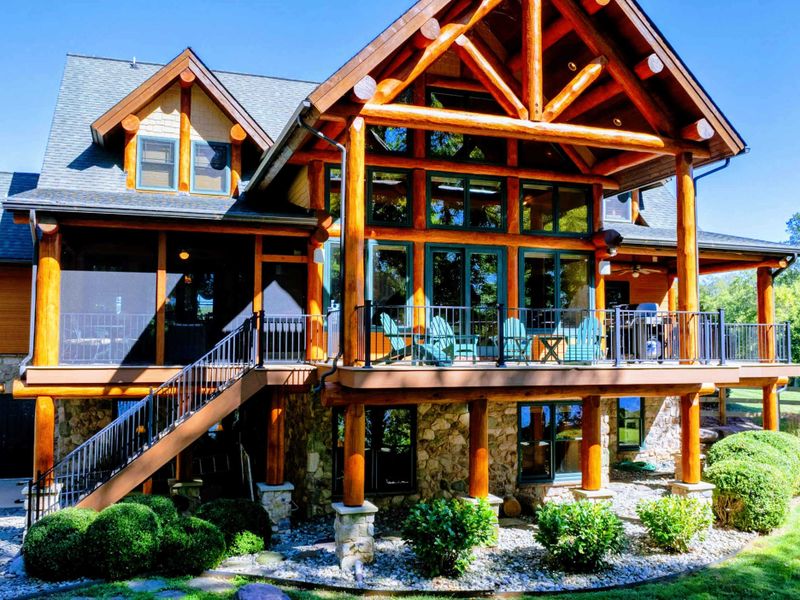 Experience the charm of this luxurious log cabin with stunning architecture, spacious balconies, and breathtaking views of the surrounding nature.