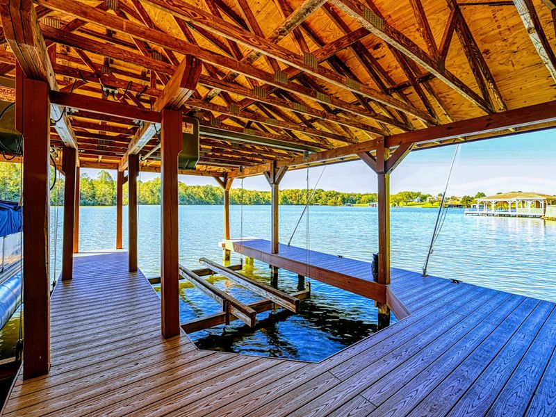 Dock - Covered picnic table on the dock provides a shady spot for lakeside lunches surrounded by greenery.
