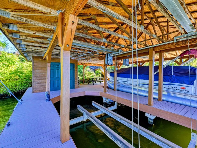 Gear up for adventure in this well-stocked shed featuring life jackets, paddleboards, and water toys, ensuring fun-filled days on the lake.